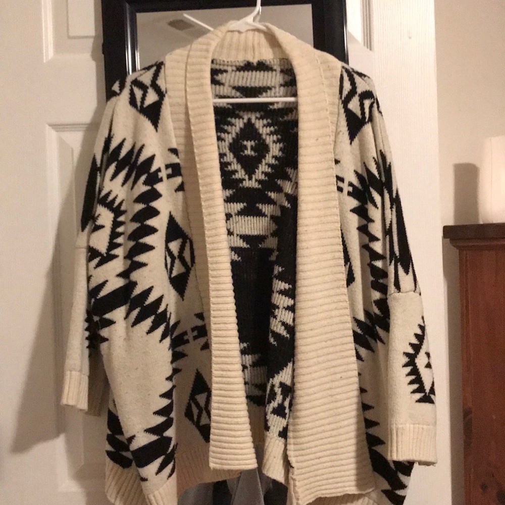 Medium, open front sweater.